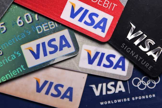Компания Visa понизила свой прогноз роста доходов